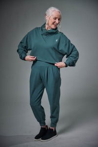 Model wearing a Chloe Angus Design Cropped Gaiter Sweatshirt