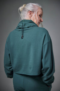 Model wearing a Chloe Angus Design Cropped Gaiter Sweatshirt