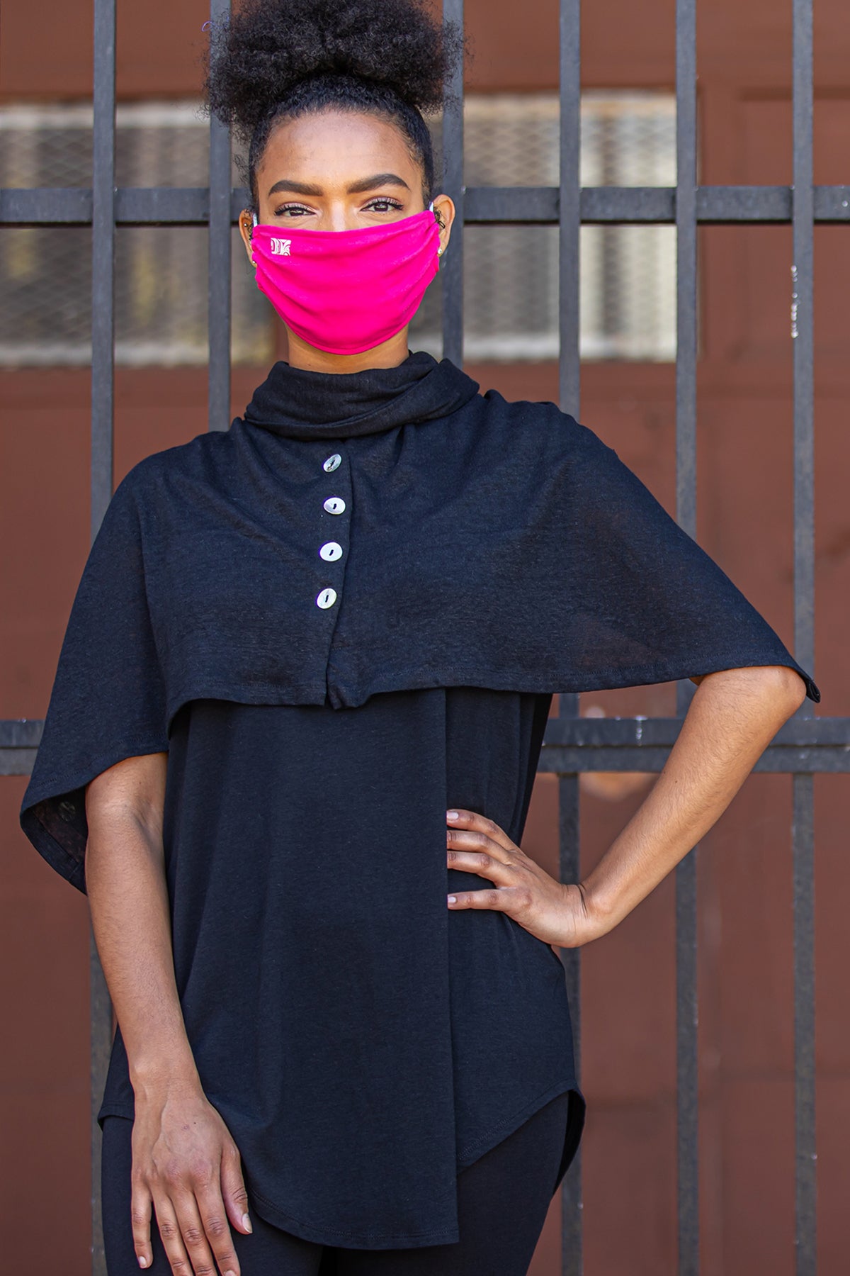 Model wearing a Chloe Angus Design Linen Button Wrap in Black
