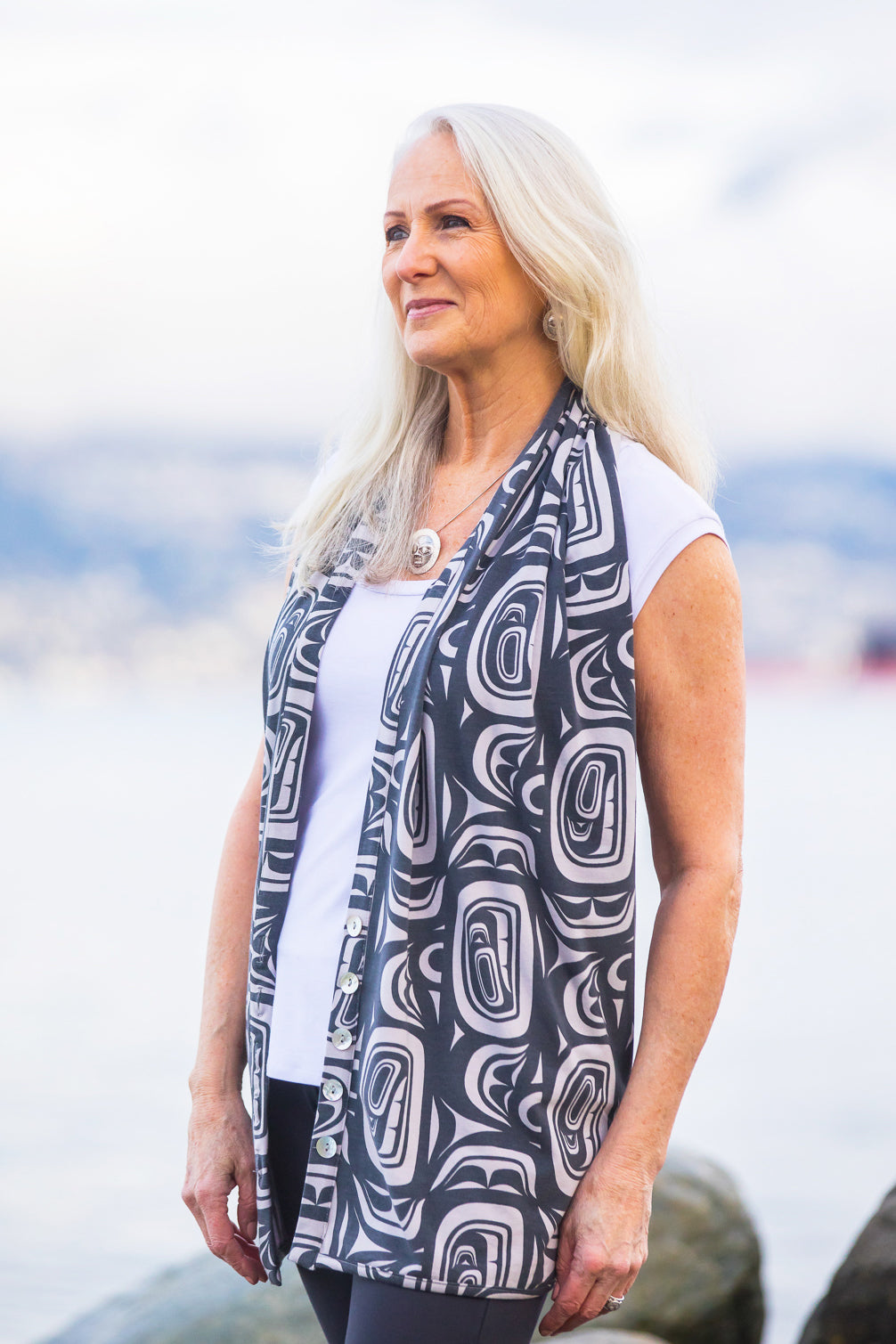 Model wearing a Chloe Angus Design Bamboo Button Wrap with Stone Modern Print by Clarence Mills