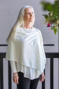 Model wearing a Chloe Angus Design Wool Button Wrap in Cream