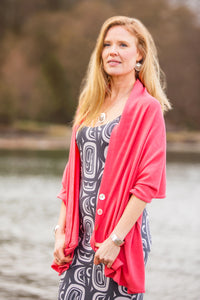 Model wearing a Chloe Angus Design Wool Button Wrap in Honeysuckle
