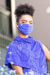 Model wearing a Chloe Angus Design Bamboo Button Wrap with Modern Burnout print by Clarence Mills