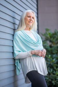 Model wearing a Chloe Angus Design Wool Button Wrap in Lichen