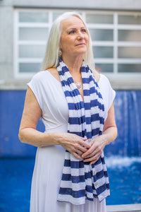 Model wearing a Chloe Angus Design Linen Button Wrap in Navy Stripe