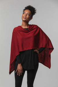 Model wearing a Chloe Angus Design Wool Button Wrap in Scarlet
