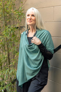 Model wearing a Chloe Angus Design Wool Button Wrap in Seaglass