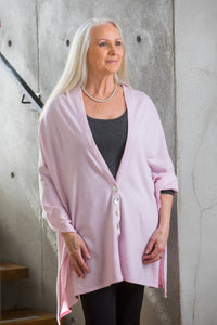 Model wearing a Chloe Angus Design Wool Button Wrap in Soft Pink