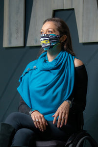 Model wearing a Chloe Angus Design Wool Button Wrap in Teal